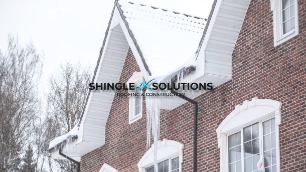 home with snow on the roof