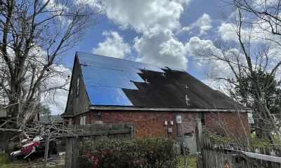 BLUE TARPED ROOF