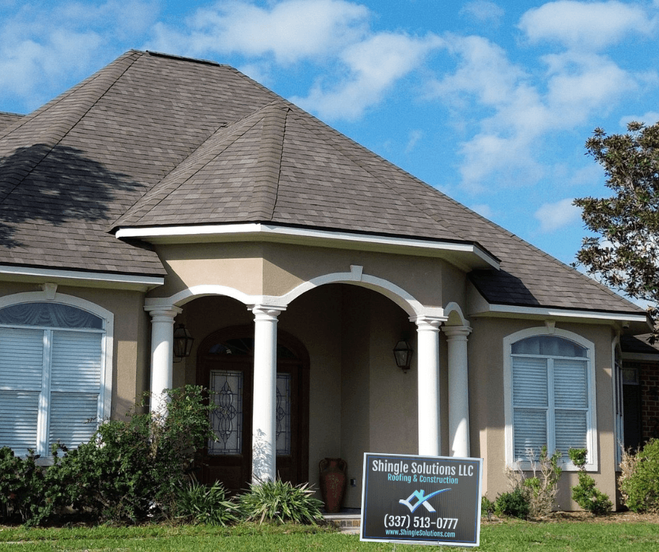 home with shingle solutions yard sign